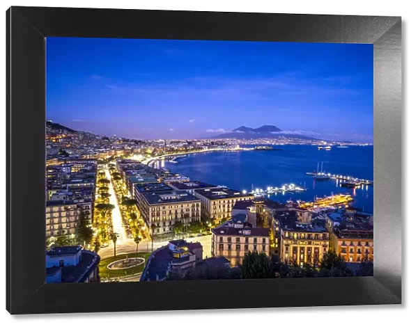 Europe, Italy, Naples. Overview of city with Mt. Vesuvius at sunset