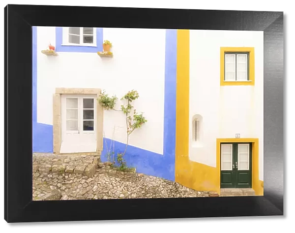 Europe, Portugal, Obidos. Colorful exterior of houses