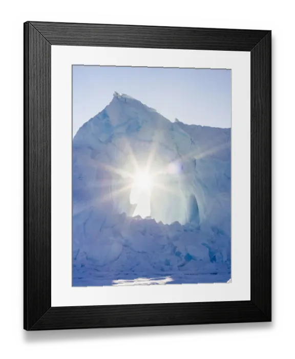Framed Print : Iceberg frozen into the sea ice of the Uummannaq fjord system during winter Framed Print : Iceberg frozen into the sea ice of the Uummannaq fjord system during winter