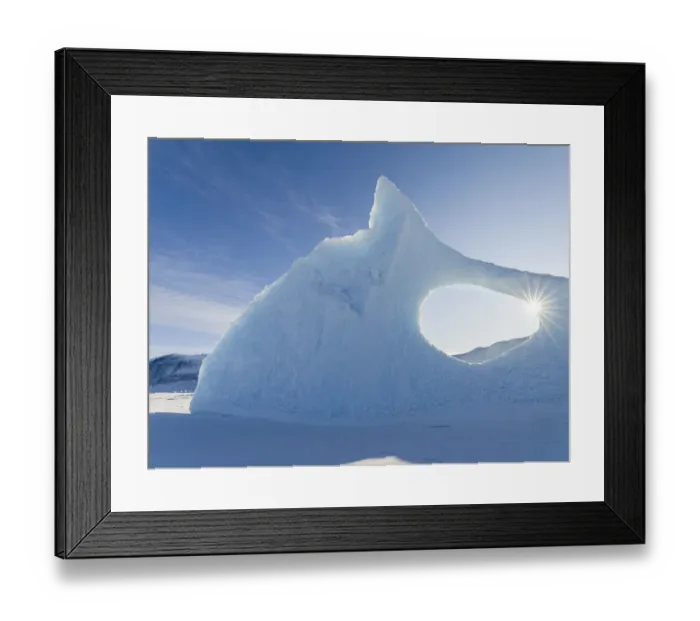 Framed Print : Iceberg frozen into the sea ice of the Uummannaq fjord system during winter Framed Print : Iceberg frozen into the sea ice of the Uummannaq fjord system during winter