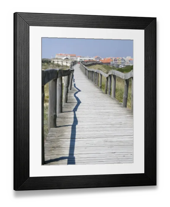 Framed Print : Portugal, Costa Nova. Beach and board walk at Costa Nova beach resort near Aveiro