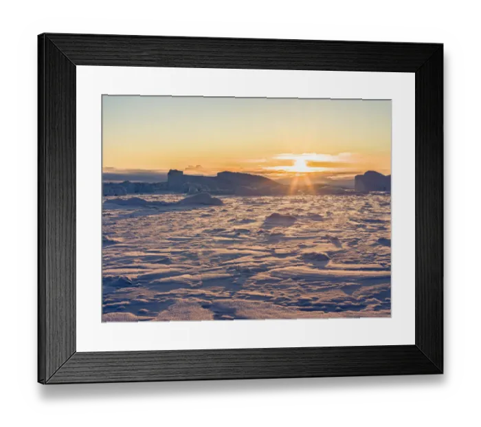 Framed Print : Icebergs frozen into the sea ice of the Uummannaq fjord system during winter Framed Print : Icebergs frozen into the sea ice of the Uummannaq fjord system during winter