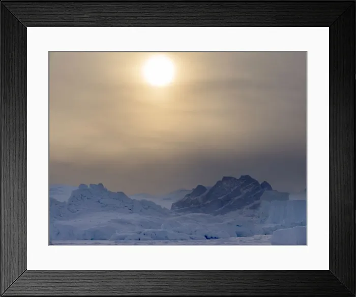 Framed Print : Icebergs frozen into the sea ice of the Uummannaq fjord system during winter