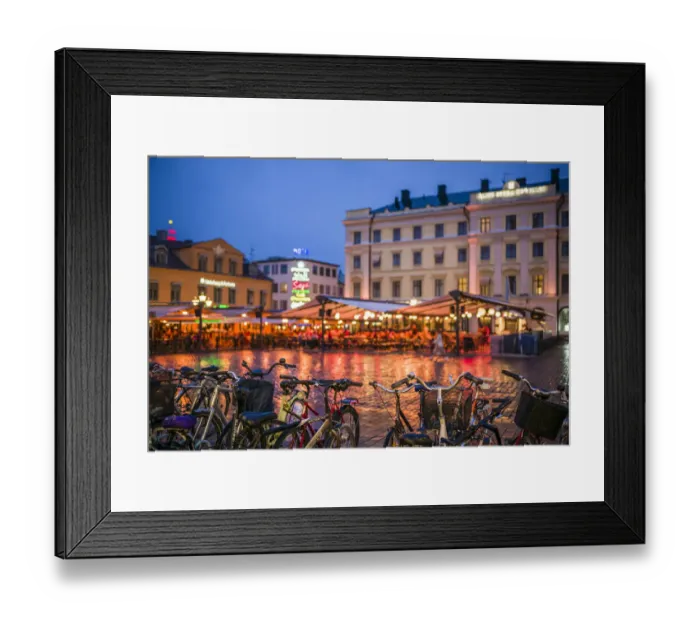 Framed Print : Sweden, Linkoping, cafes and bars on Stora target square, dusk Framed Print : Sweden, Linkoping, cafes and bars on Stora target square, dusk