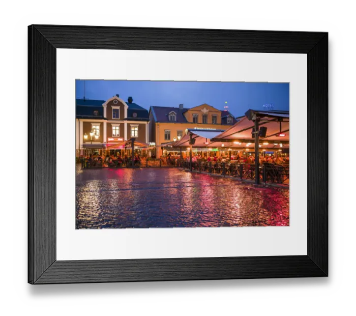 Framed Print : Sweden, Linkoping, cafes and bars on Stora target square, dusk Framed Print : Sweden, Linkoping, cafes and bars on Stora target square, dusk
