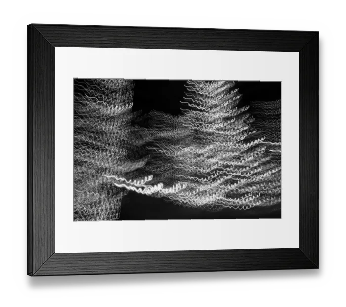 Framed Print : USA, Arizona, Buckeye. Black and white abstract motion of Christmas tree at night