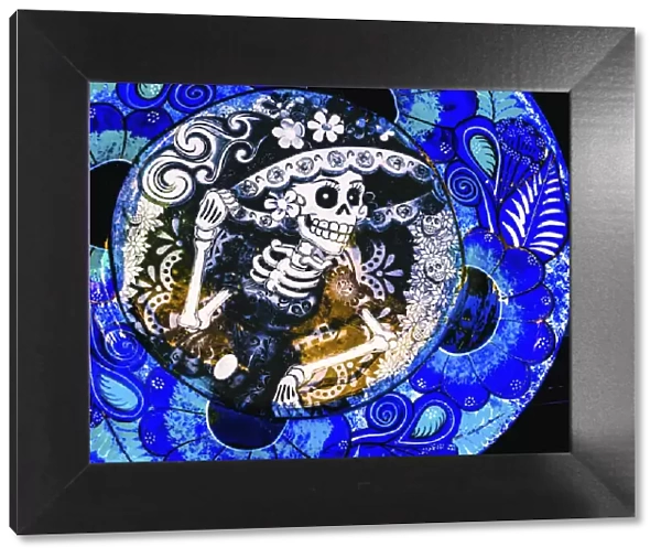 Colorful Mexican ceramic. Day of the Dead skeleton blue plate handicraft Los Cabos