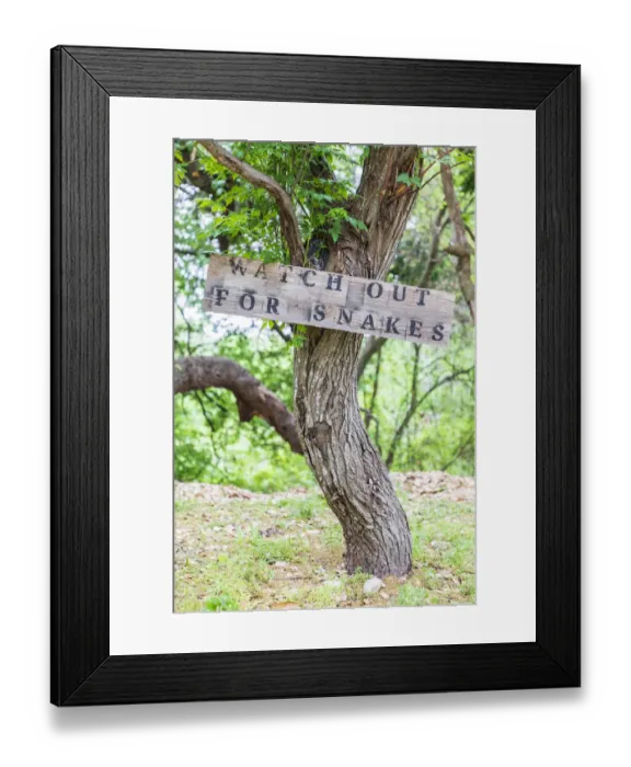 Framed Print : Castroville, Texas, USA. Sign warning snakes in the Texas Hill Country