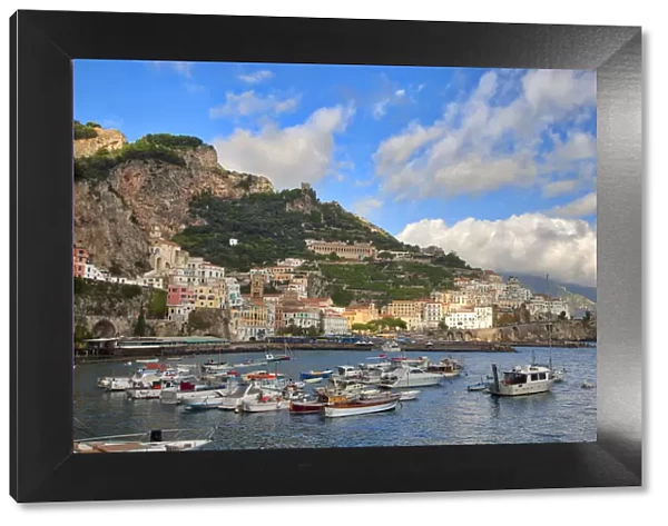 Italy, Amalfi. Boats in the harbor and coastal town of Amalfi