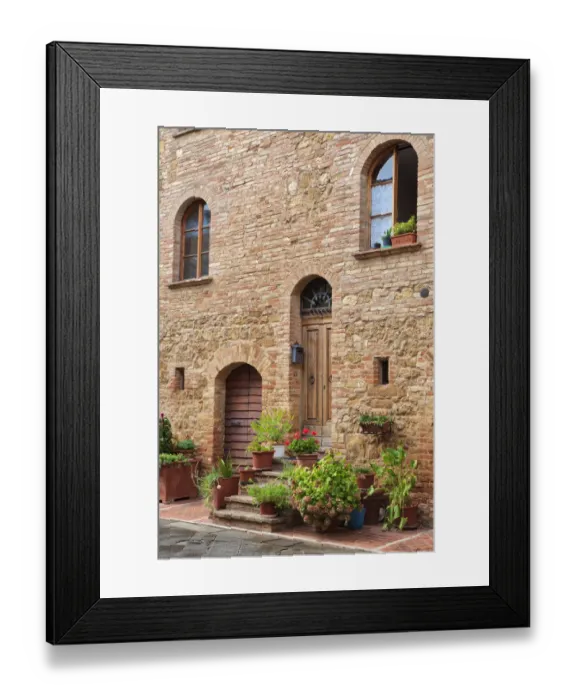 Framed Print : Italy, Tuscany, Pienza. Flower pots and potted plants decorate a narrow street in a Tuscany village