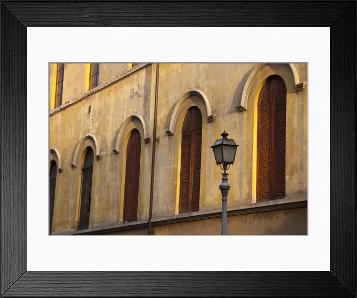 Framed Print : Italy, Tuscany, Lucca. Street lamppost and arched windows with wooden shutters Framed Print : Italy, Tuscany, Lucca. Street lamppost and arched windows with wooden shutters