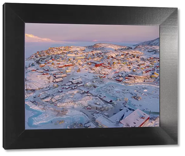Town Uummannaq during winter in northern West Greenland beyond the Arctic Circle. Greenland, Danish territory