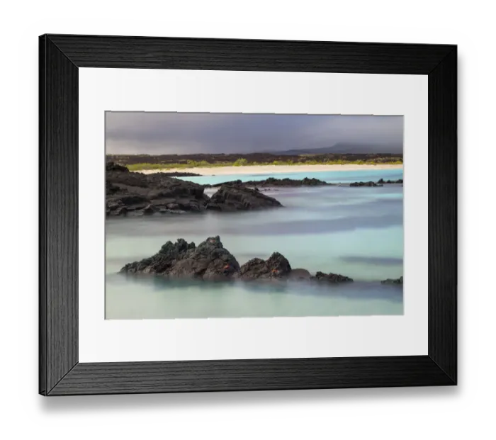 Framed Print : Lava rocks along tranquil shoreline of San Cristobal Island, Galapagos, Ecuador