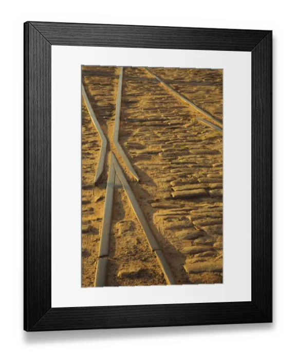 Framed Print : USA, Georgia, Savannah. Old railroad tracks along ballast stones at River Street Framed Print : USA, Georgia, Savannah. Old railroad tracks along ballast stones at River Street