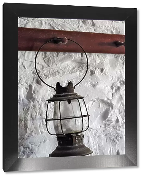 Antique lantern hanging on white wall, Shaker Village of Pleasant Hill, Harrodsburg, Kentucky