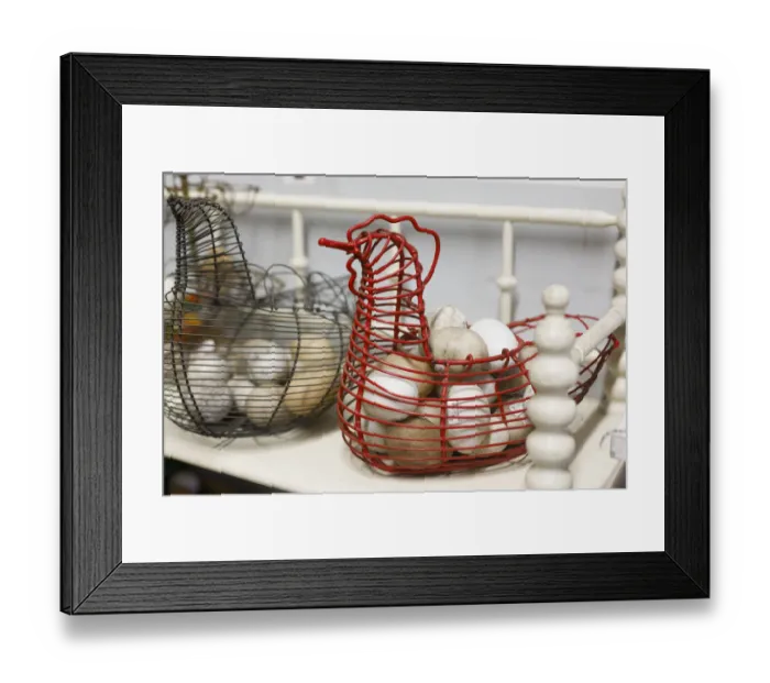 Framed Print : Chicken-shaped metal baskets holding rocks