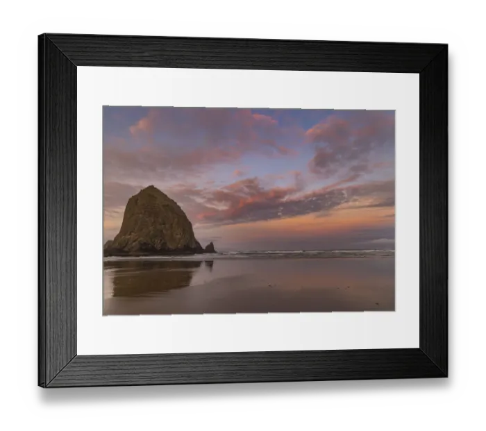 Framed Print : Sunrise clouds over Haystack Rock in Cannon Beach, Oregon, USA