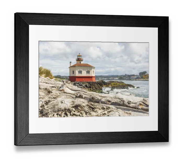 Framed Print : Bandon, Oregon, USA. Beach logs and the Coquille River Lighthouse on the Oregon coast