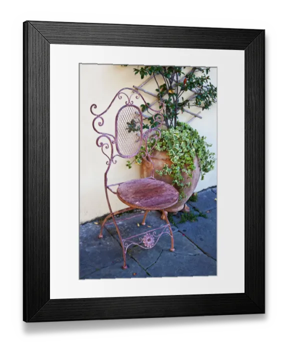 Framed Print : Italy, Tuscany, Lucca. Decorative chair and potted plant outside a shop in the Piazza dell Anfiteatro Romano Framed Print : Italy, Tuscany, Lucca. Decorative chair and potted plant outside a shop in the Piazza dell Anfiteatro Romano