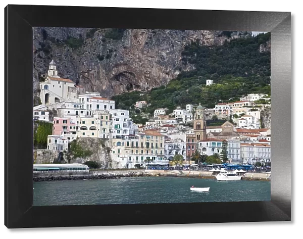 Italy, Amalfi. The coastal town of Amalfi as seen from a boat in the harbor