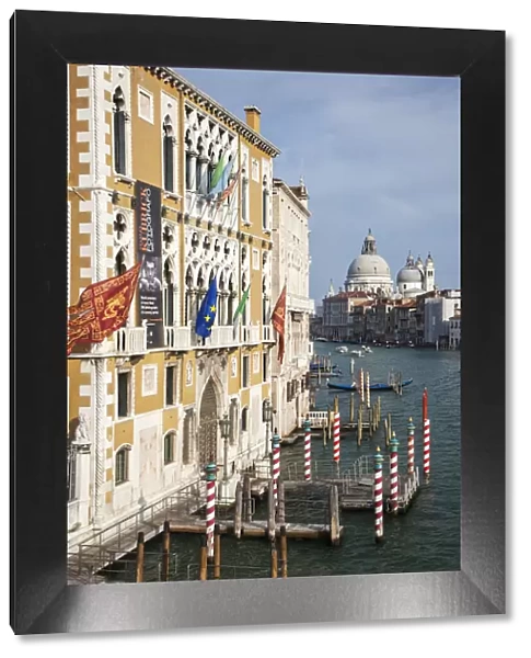 Italy, Venice. Buildings along the Grand Canal with Santa Maria della Salute beyond
