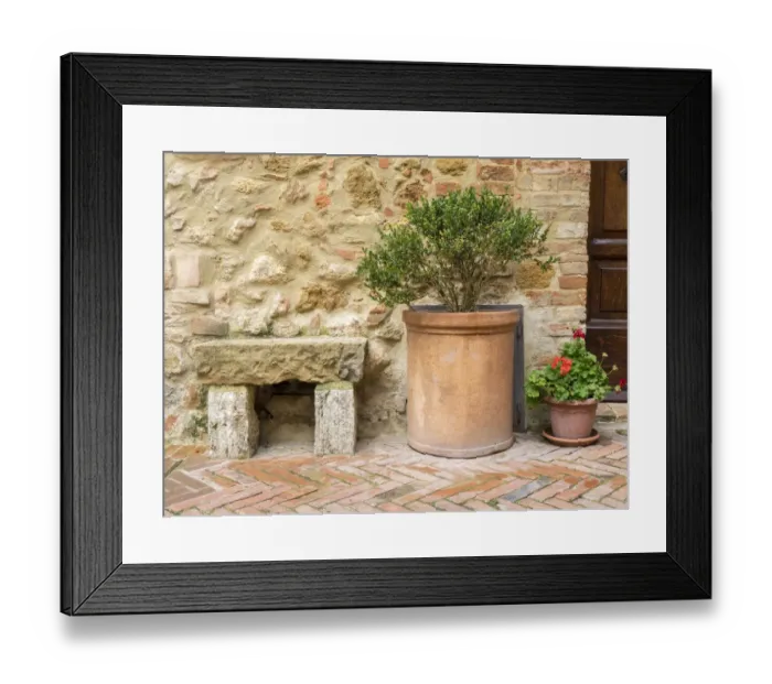 Framed Print : Italy, Tuscany, Pienza. Potted plants and stone bench along the streets