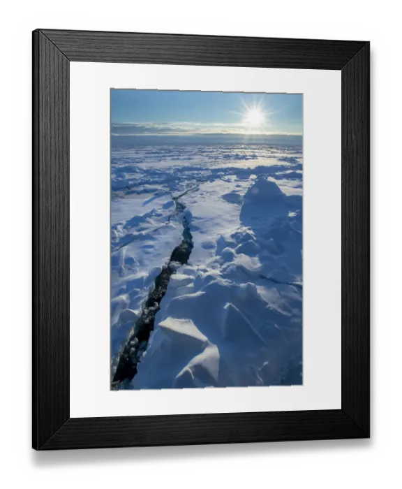 Framed Print : Norway. Icescape at 84 degrees north, crack in ice with sunburst Framed Print : Norway. Icescape at 84 degrees north, crack in ice with sunburst