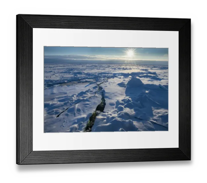 Framed Print : Norway. Icescape at 84 degrees north, crack in ice with sunburst Framed Print : Norway. Icescape at 84 degrees north, crack in ice with sunburst