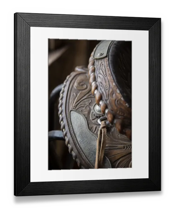 Framed Print : USA, Colorado, Custer County, Westcliffe, Music Meadows Ranch. Tack room. Tooled leather western saddle. (PR)