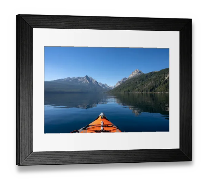 Framed Print : USA, Idaho, Redfish Lake. Kayak facing Sawtooth Mountains