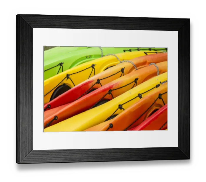 Framed Print : Issaquah, Washington State, USA. Colorful kayaks lying on their side at a kayak rental place at Lake Sammamish State Park Framed Print : Issaquah, Washington State, USA. Colorful kayaks lying on their side at a kayak rental place at Lake Sammamish State Park