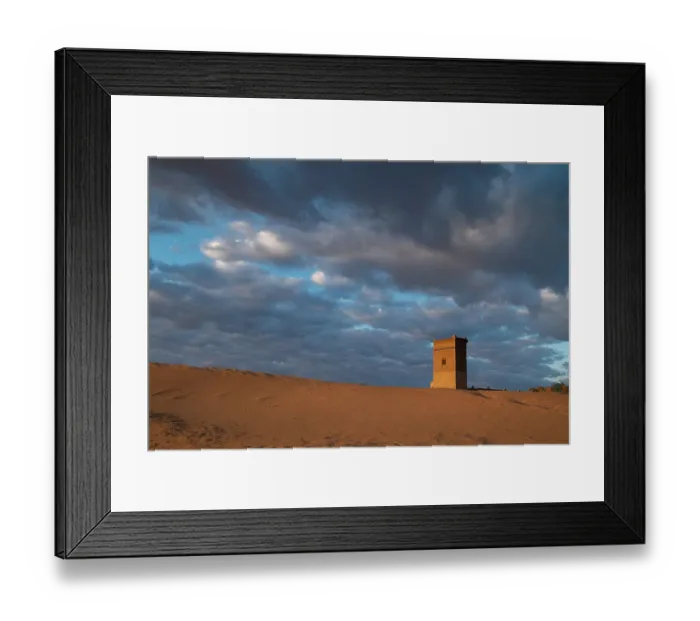 Framed Print : Water tower glows orange in sunrise light