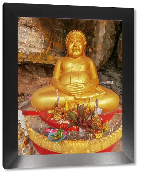 Laos, Luang Prabang. Vat Thammo Thayaram on Mount Phousi. Fat Buddha statue