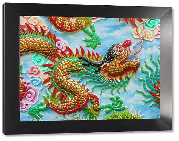 Bangkok, Thailand. Colorful relief of dragon or serpent