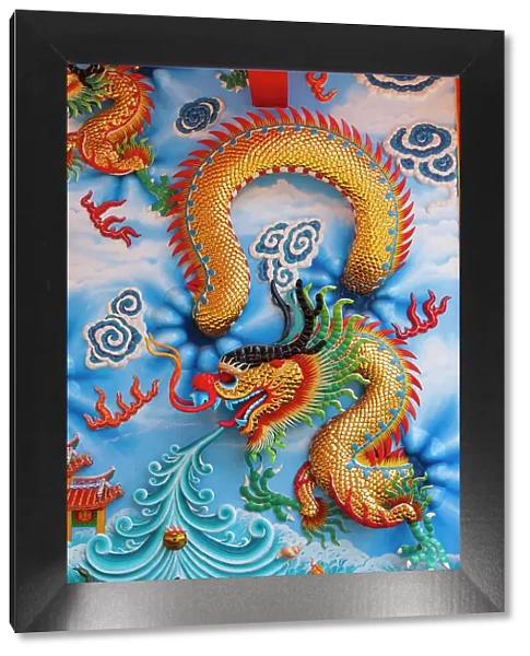 Bangkok, Thailand. Colorful relief depicting dragon or sea serpent