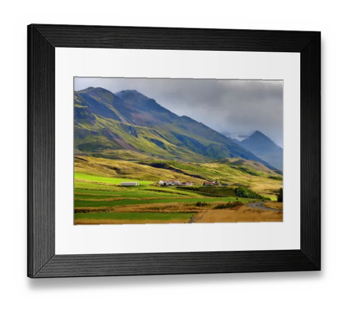 Framed Print : Mountains towering over Oxnadalur with road climbing up to Oxnadalsheidi. Europe, Iceland