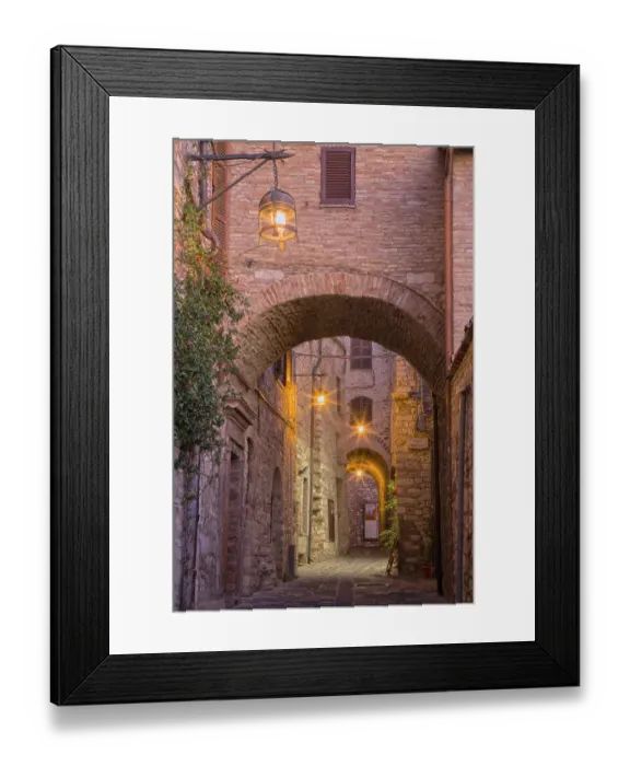 Framed Print : Italy, Umbria, Assisi. Alleyway with arches and lanterns in the evening Framed Print : Italy, Umbria, Assisi. Alleyway with arches and lanterns in the evening