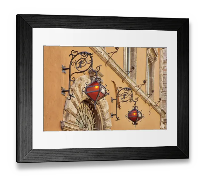 Framed Print : Italy, Umbria, Assisi. Wrought iron dragon lights on a wall above an entrance Framed Print : Italy, Umbria, Assisi. Wrought iron dragon lights on a wall above an entrance