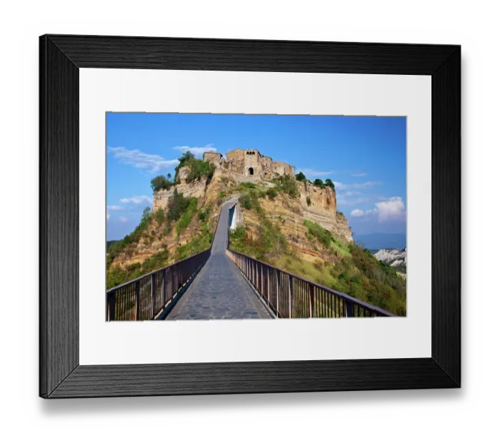 Framed Print : Italy, Tuscany. Evening view of Civita di Bagnoregio and the long bridge leading to town Framed Print : Italy, Tuscany. Evening view of Civita di Bagnoregio and the long bridge leading to town
