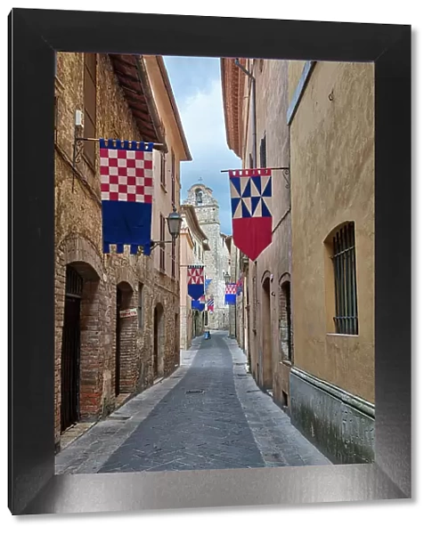 Italy, Umbria. Streets in the historic district of San Gemini decked out with festival jousting flags