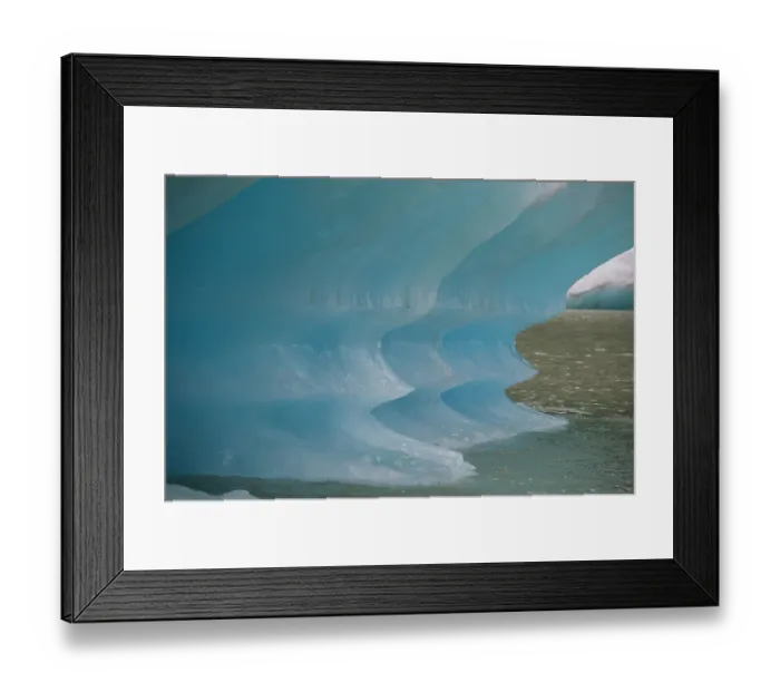 Framed Print : Blue iceberg glows in Shakes Lake
