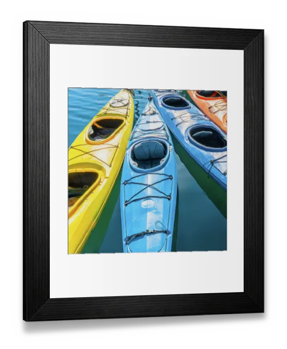 Framed Print : Four colorful kayaks positioned in an array