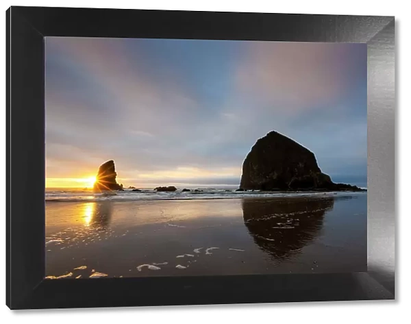 USA, Oregon. Cannon Beach and Haystack Rock at sunset