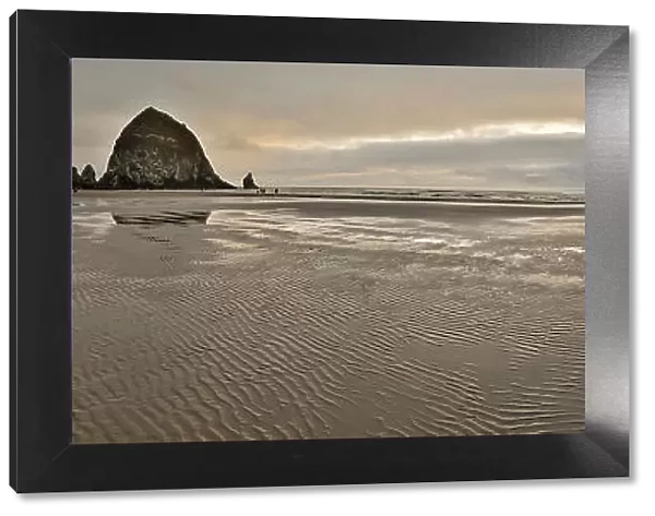 USA, Oregon. Cannon Beach and panorama of Haystack at sunset and low tide