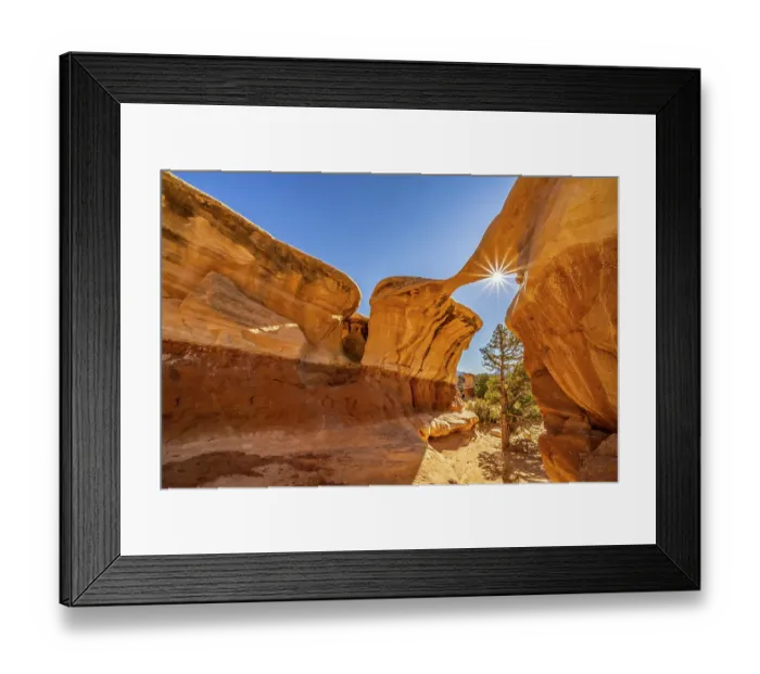 Framed Print : USA, Utah, Grand Staircase Escalante National Monument. Sunburst on eroded rock formations in Devil's Garden