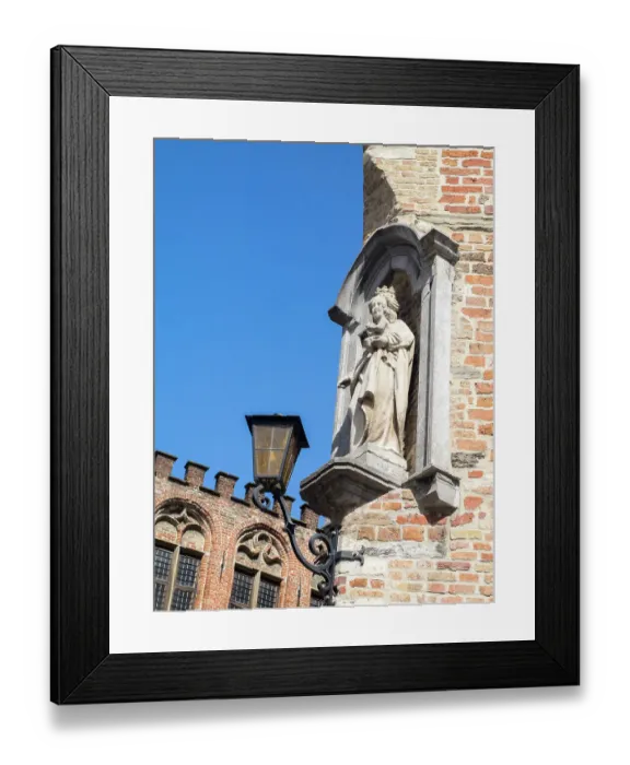 Framed Print : Belgium, Brugge. A stone statue on the cornerstone of a building Framed Print : Belgium, Brugge. A stone statue on the cornerstone of a building