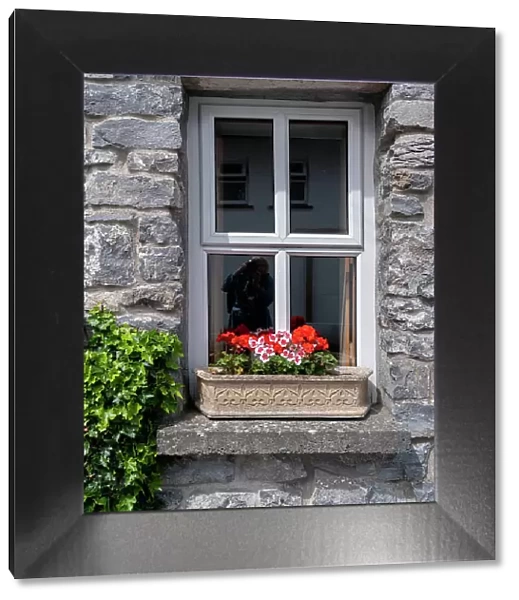 Window brings a smile to passersby in the historic village of Cong, County Mayo, Ireland