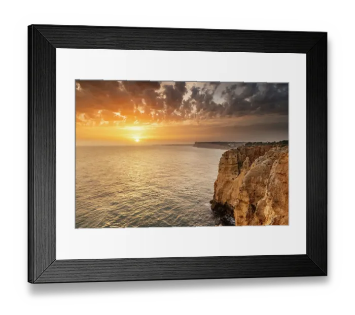 Framed Print : Dramatic sunset clouds over Cliffs along the coast at Ponta da Piedade in Lagos, Portugal Framed Print : Dramatic sunset clouds over Cliffs along the coast at Ponta da Piedade in Lagos, Portugal