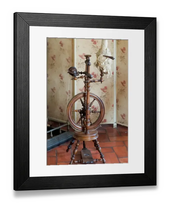 Framed Print : Sintra, Portugal. National Palace interior. Spinning wheel by the fireplace (Editorial Use Only)