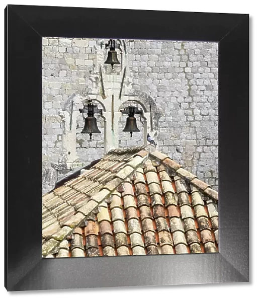 Croatia, Dubrovnik. Bell tower with three bells on top of the Church of Our Lady of Mt. Carmel